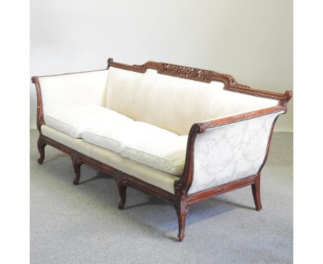 A Georgian style cream upholstered sofa, on cabriole legs, 212cm