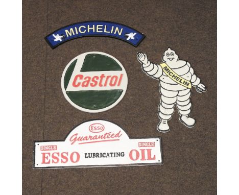 A reproduction curved Michelin sign, together with a Michelin plaque, a Castrol sign, and an Esso sign (4)