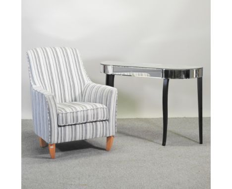 A modern grey striped upholstered armchair, together with a mirrored console table, 112cm (2)