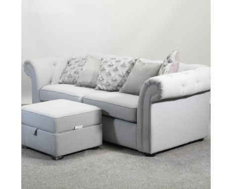 A modern grey upholstered chesterfield sofa, 210cm, together with a matching footstool and a collection of cushions (2)