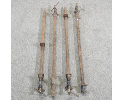 A collection of four sash clamps