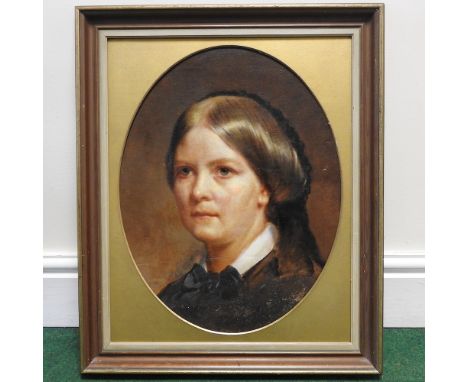 English School, 19th century, a head and shoulders portrait of a young lady, oil on canvas, laid on board, oval, 46 x 35cm