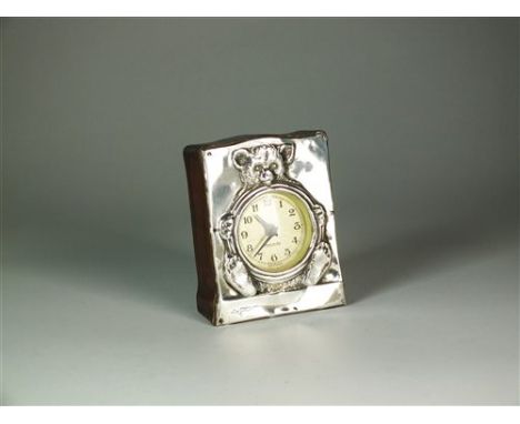 A silver mounted timepiece, Henry Williamson Ltd, Birmingham 1909, the circular engine turned dial with Arabic numerals and s