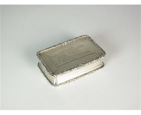 A Victorian silver presentation snuff box, George Unite, Birmingham 1862, of rectangular form with casT floral borders, the c