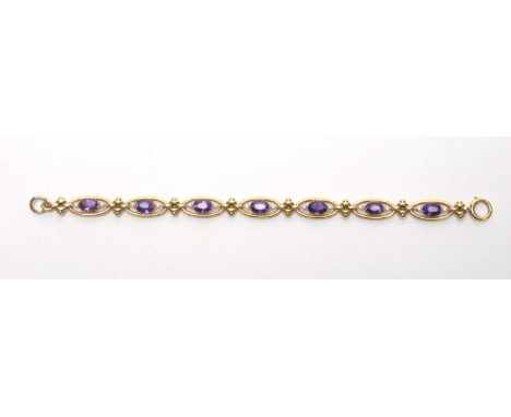 An amethyst and seed pearl bracelet, each of the seven links set with oval facet cut amethyst and seed pearl pairs, in yellow