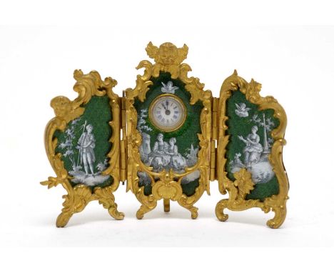 A French 19th Century triptych dressing table clock, in ormolu with putti and leaf scrolls, decorated in green guilloche enam