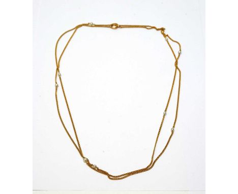 A yellow metal and pearl chain necklace, early 20th Century, of cable link and set with pearls (possibly cultured), the clasp