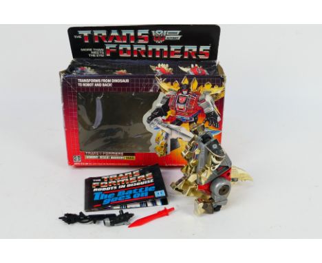 Hasbro Takara - Transformers - A boxed G1 Dinobot Desert Warrior Snarl # 5974. The figure appears in Very Good condition and 