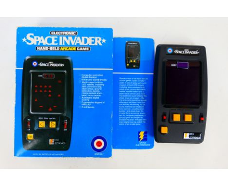 Entex - A boxed Electronic Space Invader hand held arcade game # 6012. The game appears Near Mint with instructions and worke