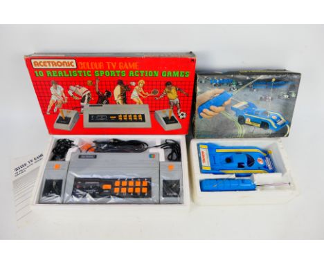 Acetronic - Tandy - A boxed Acetronic Colour TV Game console and a boxed Tandy Radio Controlled Racing Porsche. The items app