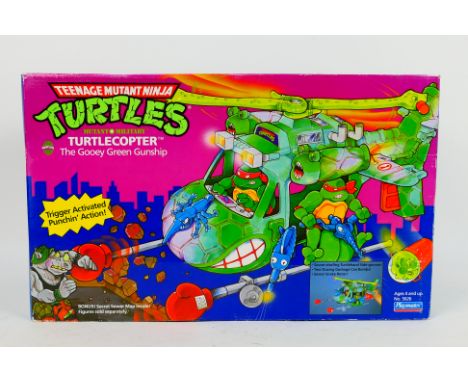 Playmates - Teenage Mutant Ninja Turtles - A boxed Mutant Military Turtlecopter # 5626. The 1990 dated box is taped shut and 