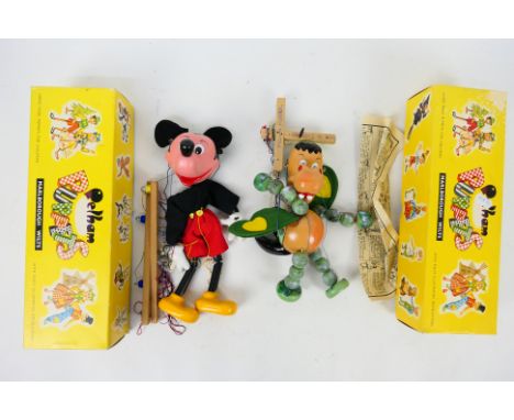 Pelham Puppets - Two boxed vintage Pelham Puppets. Lot consists of SL12 Mickey Mouse & Baby Dragon. Puppets appear have attac