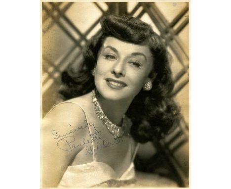 GODDARD PAULETTE: (1910-1990) American actress. Vintage signed sepia 8 x 10 photograph of Goddard in an appealing head and sh