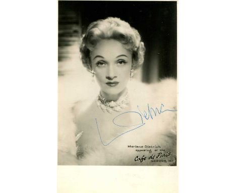 DIETRICH MARLENE: (1901-1992) German-born American actress and singer. Vintage signed postcard photograph of Dietrich in a he