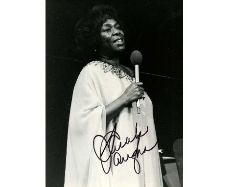 VAUGHAN SARAH: (1924-1990) American jazz singer. Signed 7 x 9.5 photograph of The Divine One standing in a three-quarter leng