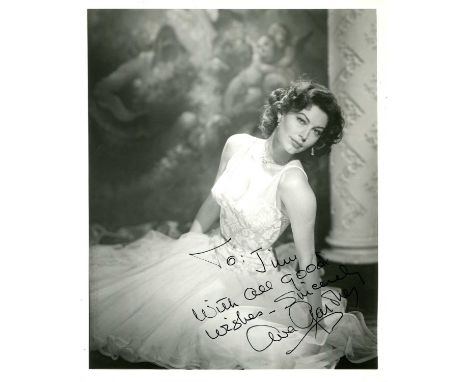 GARDNER AVA: (1922-1990) American actress. Signed and inscribed 8 x 10 photograph of Gardner seated in an elegant full-length