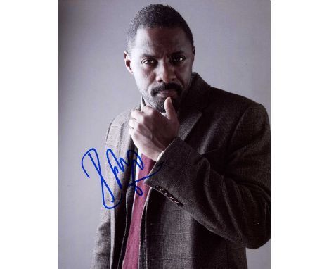 ELBA IDRIS: (1972- ) English actor. Signed colour 8 x 10 photograph of Elba standing in a half-length pose, in costume as DCI