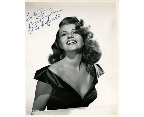 HAYWORTH RITA: (1918-1987) American actress. An excellent vintage signed and inscribed 8 x 10 photograph of Hayworth in an ap