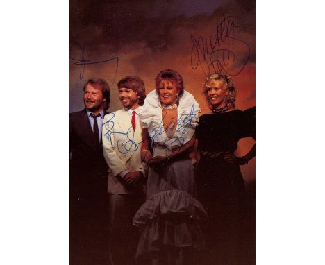 ABBA: Signed colour 4 x 6 postcard photograph by all four members of the Swedish pop supergroup of the 1970s individually, co