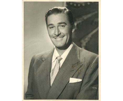 FLYNN ERROL: (1909-1959) Australian actor. An excellent vintage signed 11 x 14 photograph of the dashing actor in a smiling h