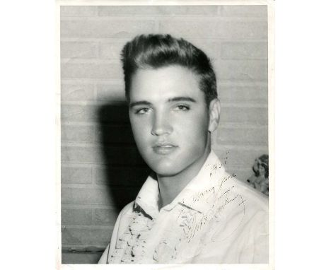 PRESLEY ELVIS: (1935-1977) American Rock 'n' Roll singer. Vintage signed and inscribed 8 x 10 photograph of the young, handso