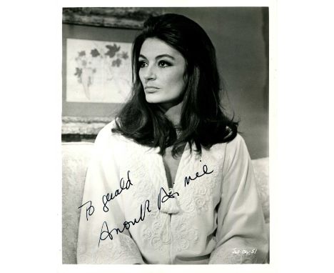AIMEE ANOUK: (1932- ) French actress. Signed and inscribed 8 x 10 photograph of Aimee seated in a half-length pose in costume
