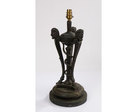 Neoclassical desk or table lamp, with three arched supports depicting fauns above a circular base, 40cm high