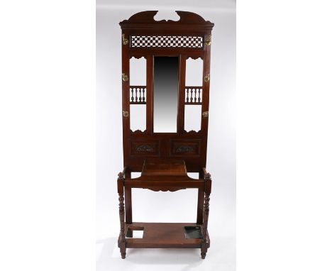 Edwardian mahogany hall stand, the arched top above fret panel and  six hooks either side of a rectangular mirror above the h