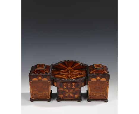 An exceptional Regency specimen wood tea caddy, modelled as a sideboard with gadrooned edges to the lip of the hinged top wit