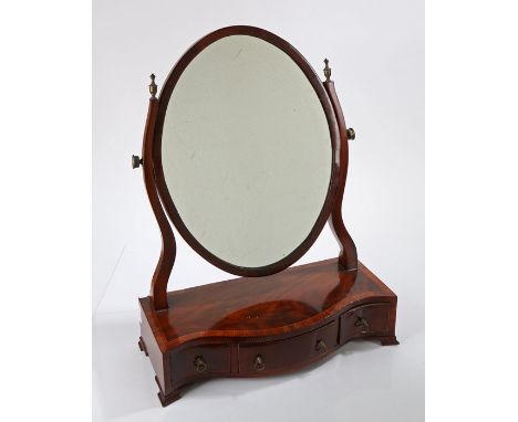 George III mahogany and chequer strung toilet mirror, the oval mirror plate held within a pair of shaped supports above the s