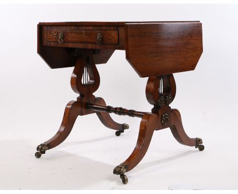 Small Regency rosewood and brass inlaid sofa table, the drop leaves with canted corners, with frieze drawer, raised on pierce