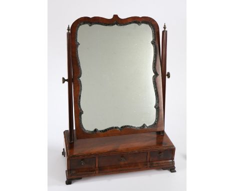 George III mahogany toilet mirror, the mirror plate within an undulating gesso frame held between channel moulded uprights ab