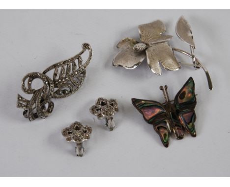 STERLING SILVER FLORAL SPRAY BROOCH; A MEXICAN SILVER AND ABALONE SHELL BUTTERFLY BROOCH, Marcasite foliate scroll brooch and