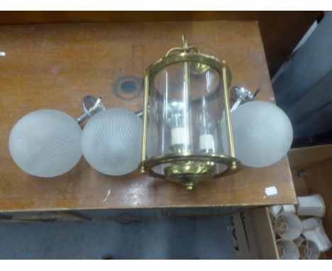 A SET OF THREE BEDROOM SINGLE WALL BRACKET LAMPS, WITH FROSTED GLASS GLOBE SHADES AND A BRASS CIRCULAR PORCH LANTERN WITH PLA