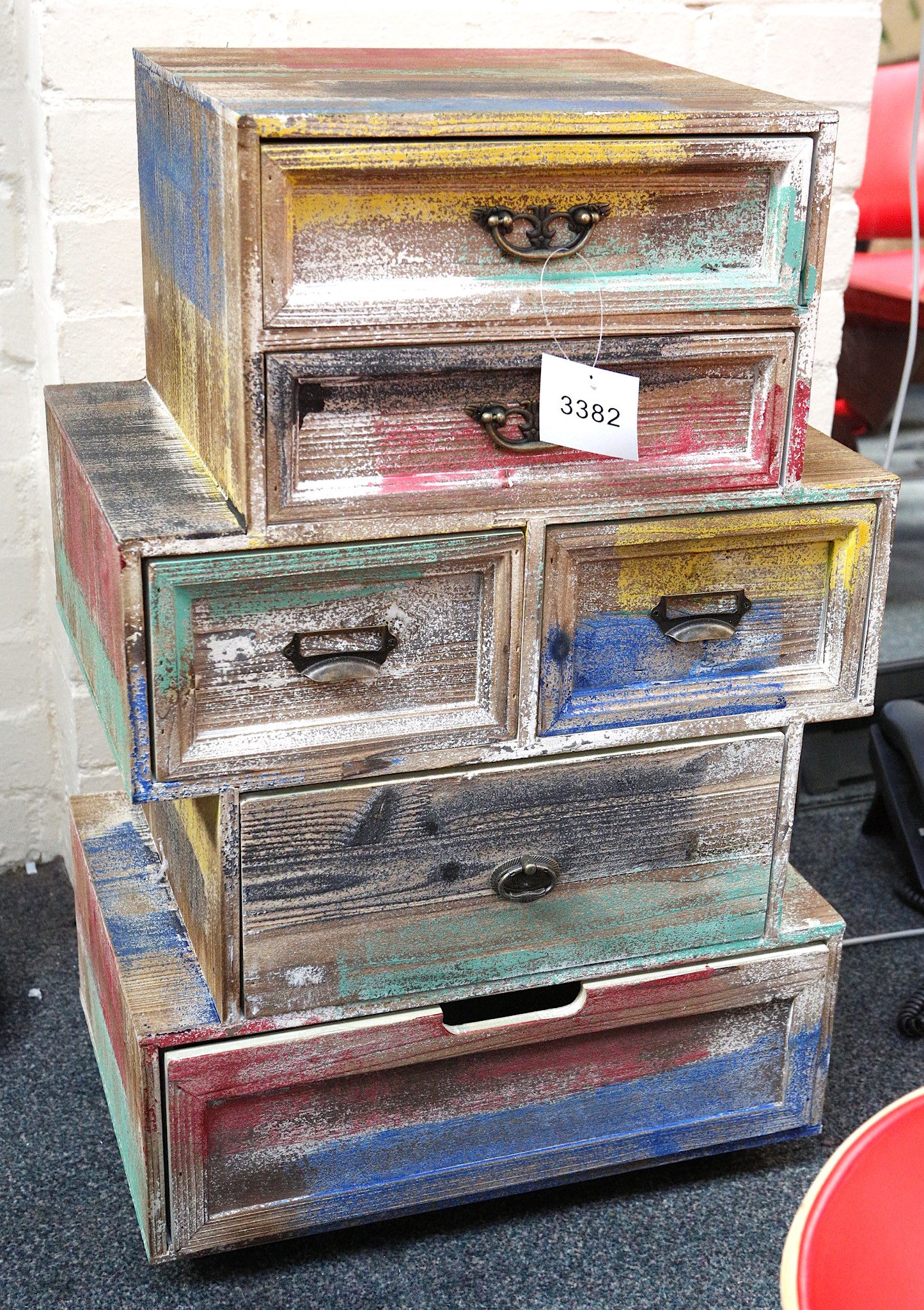 A Pine Chest Of Six Drawers In A Distressed Multi Coloured Paint