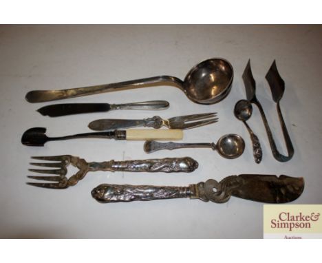 A pair of continental white metal fish servers; a white metal ladle; various other items to include a plated asparagus server