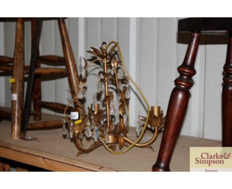 A gilt metal leaf effect and prism drop pendant light fitting