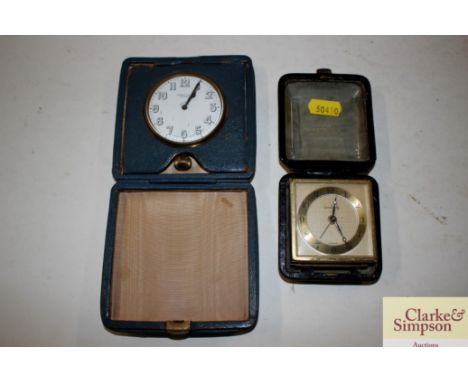 A Harrods eight day clock, in travelling case; and a German alarm clock 