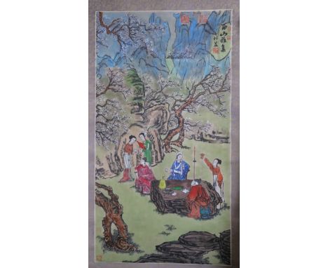 A Chinese scroll painting of figures in a landscape