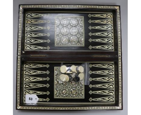 An Indian mother of pearl and bone chess/backgammon games box with horn and bone counters width 42cm depth 21cm