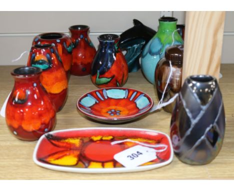 A collection of modern Poole Pottery, including five small Volcano vases, a Volcano pin dish, a Precious ginger jar and cover