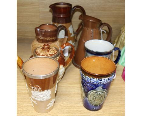A Doulton Lambeth Victoria commemorative beaker, a similar 1911 Coronation mug and five other items, comprising a Victoria 'Q