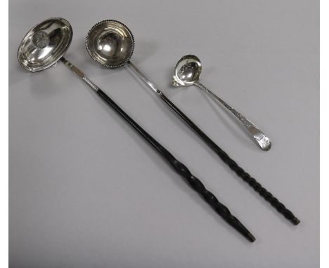 A Scottish silver toddy ladle, Edinburgh 1804 and two Georgian toddy ladles with whalebone handles