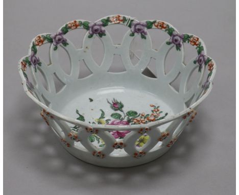 A Worcester polychrome basket, c.1770, the interior painted with a bouquet of flowers and the interlocking guilloche border p