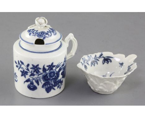 A Worcester Mansfield pattern butter boat, c.1760 and a Worcester floral pattern mustard pot and cover, c.1770, 9cm and 9.5cm