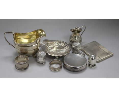 A Georgian silver and silver-gilt cream jug and sundry small silver items, including a shell butter dish, am embossed cream j