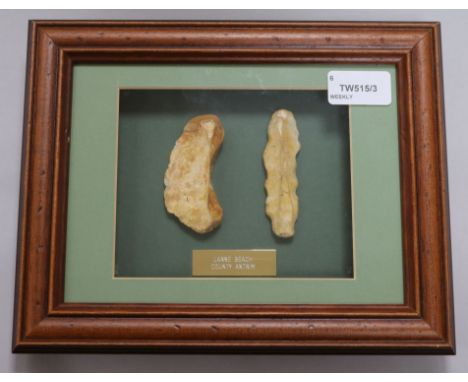 A collection of framed Neolithic and other tools and flint arrow heads, including a Paleolithic fine pointed hand axe, Clacto