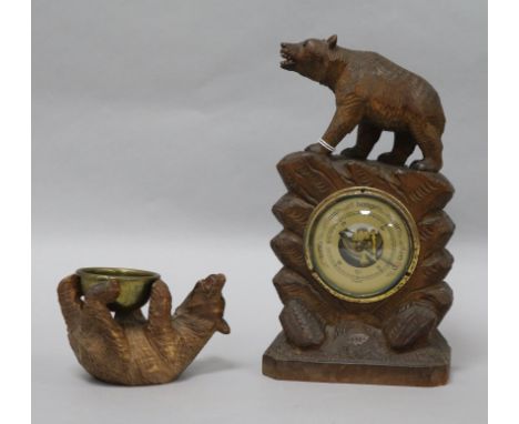 A Black Forest barometer and another carving barometer height 23cm