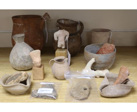 A collection of pottery artefacts, possibly Roman, Pre-Columbian and other, including three oil lamps, a mug with etched geom