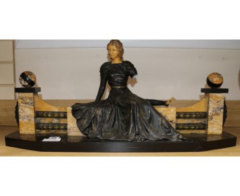 An Art Deco spelter and marble girl on a a bench